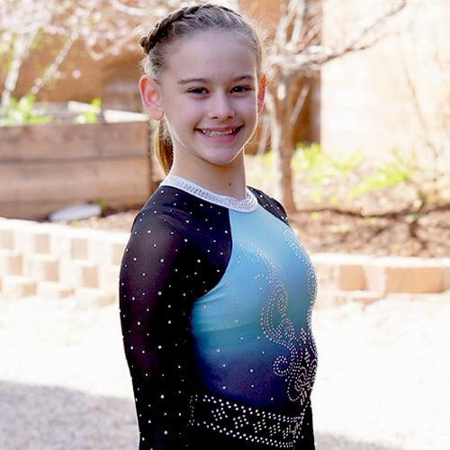 Snowflake ambassador in blue competition leotard