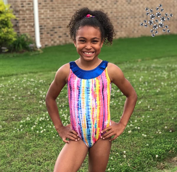 Gymnast in rainbow gymnastics leotard