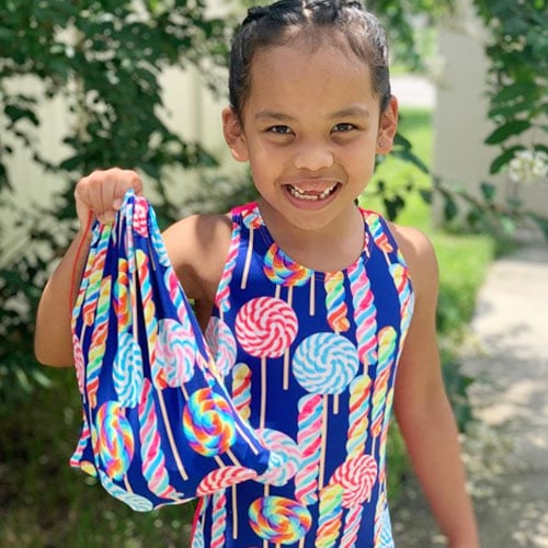 Blue snowflake designs leotard with matching grip bag.