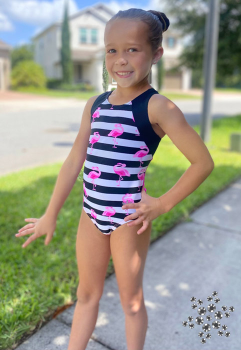 gymnast in black and pink flamingo leotard