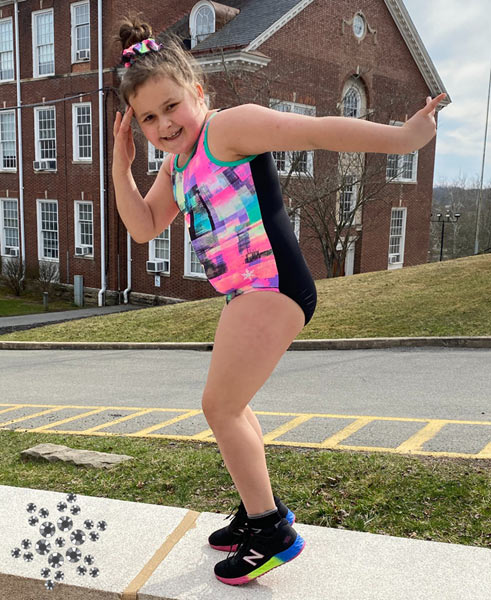 Snowflake Designs Ambassador in pink leotard.