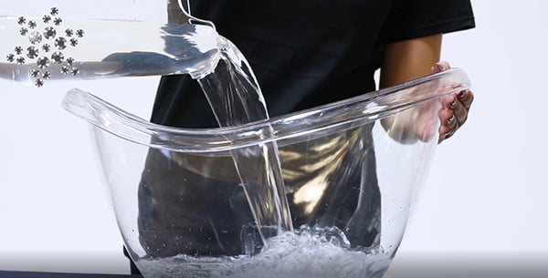 adding cold water to bowl