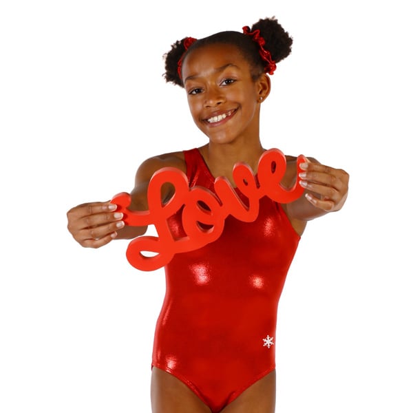 A gymnast in a red leotard holding a 'love" sign.