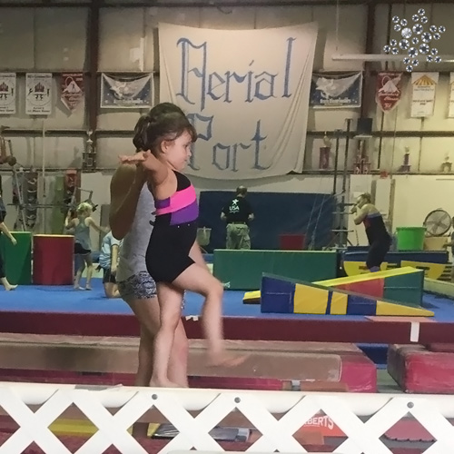 Nevaeh in a gymnastics leotard