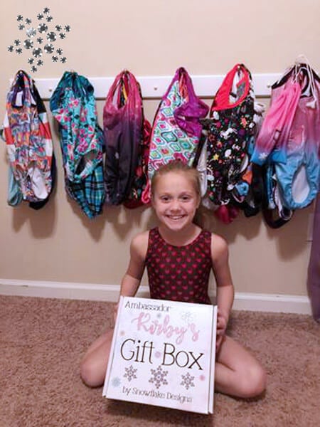 Gymnast with Snowflake Designs Ambassador box.